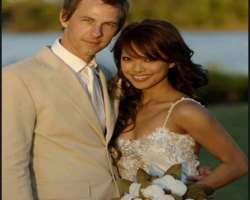 Her wedding dress was designed by Bora of Bora Cou Her wedding dress was designed by Bora of Bora Couture along with her friend who designed a pearl set for the back of the gown and diamond pieces for